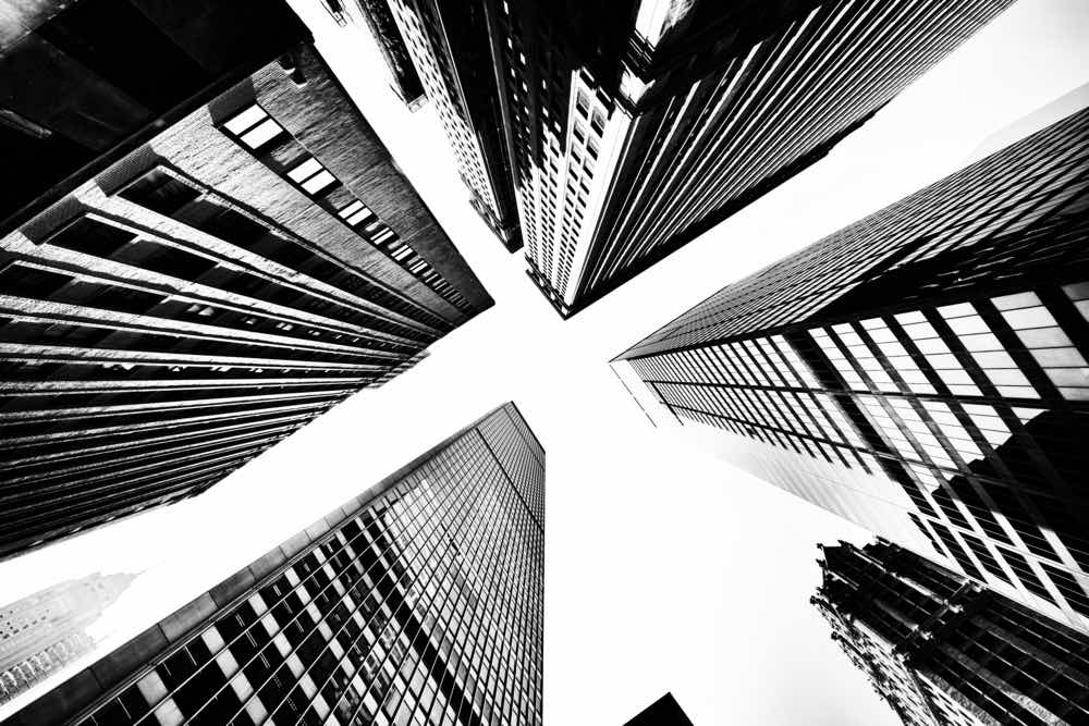 Architectural photography in monochrome using low-angle composition techniques. Skyscrapers during the day.
