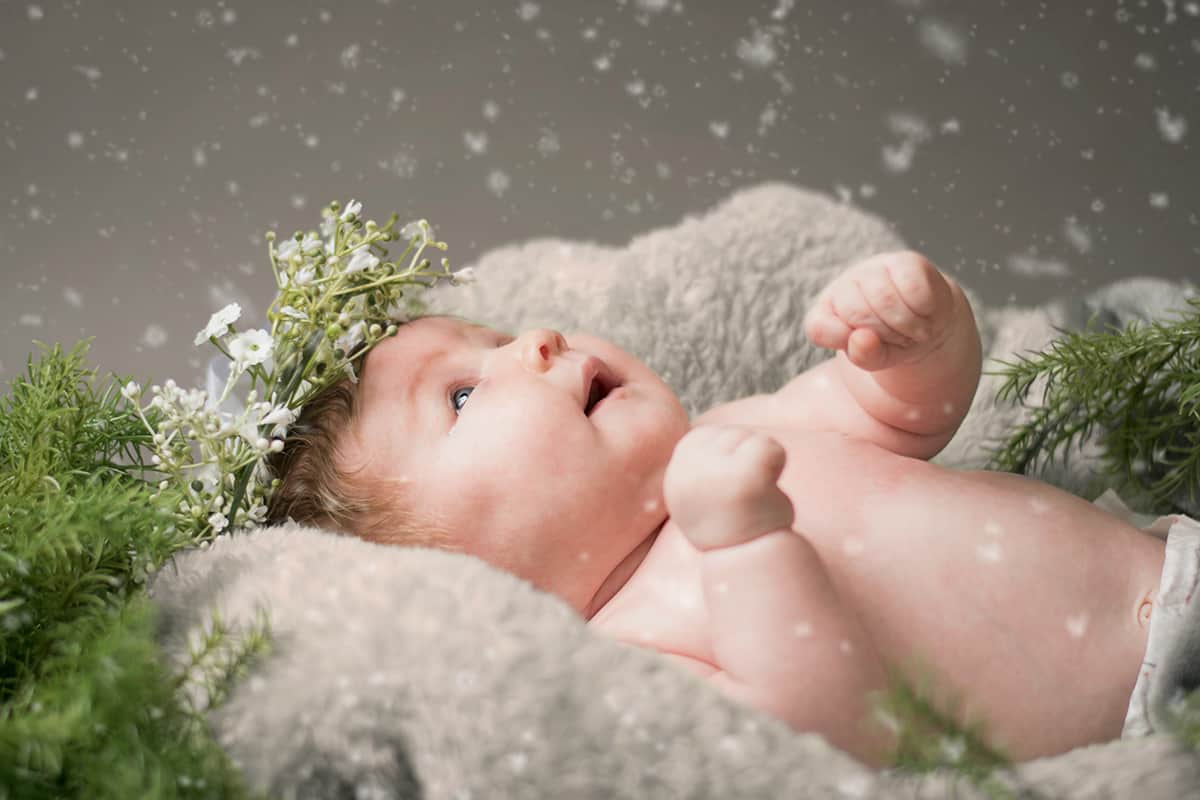baby looking at snow.