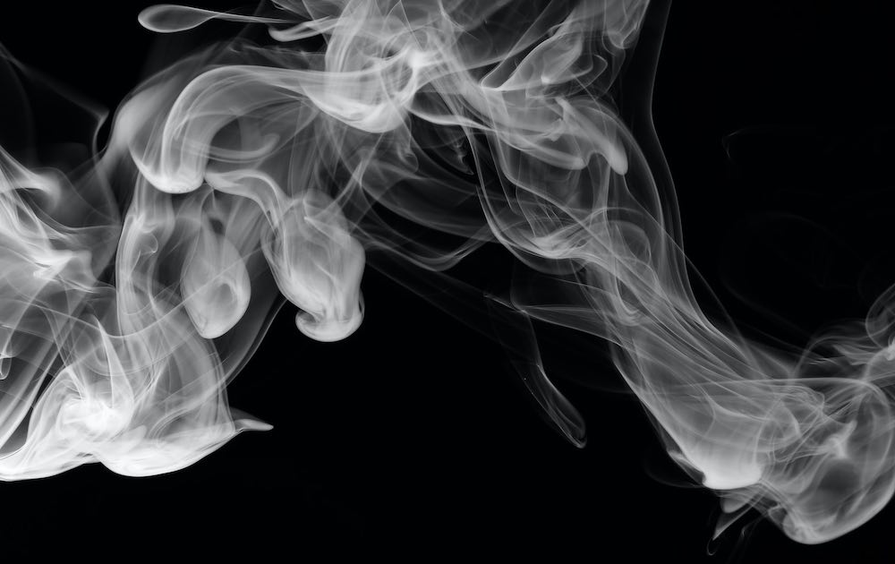 surreal smoke photo in a dark room.