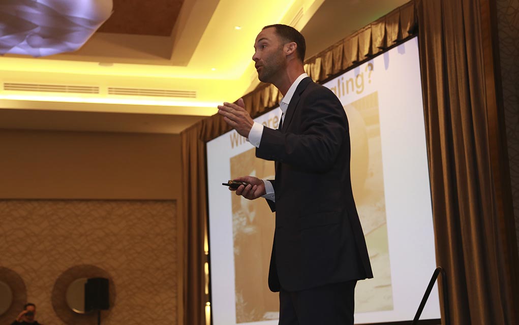 man giving speech at a business event.