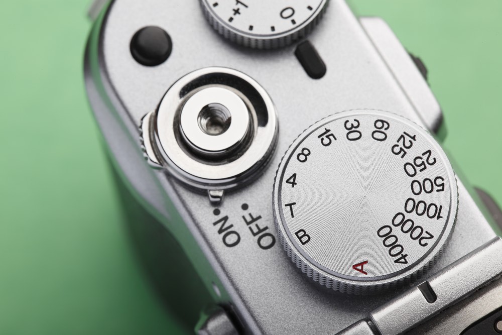 Close-up view of the shutter speed dial of a modern digital camera set to 1/4000s. Fast shutter speed setting suitable for sports and action photography.