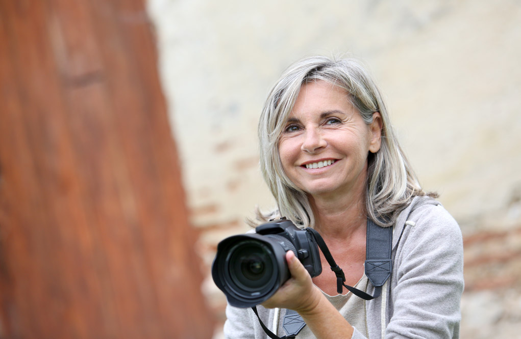 female photographer with a digital camera.