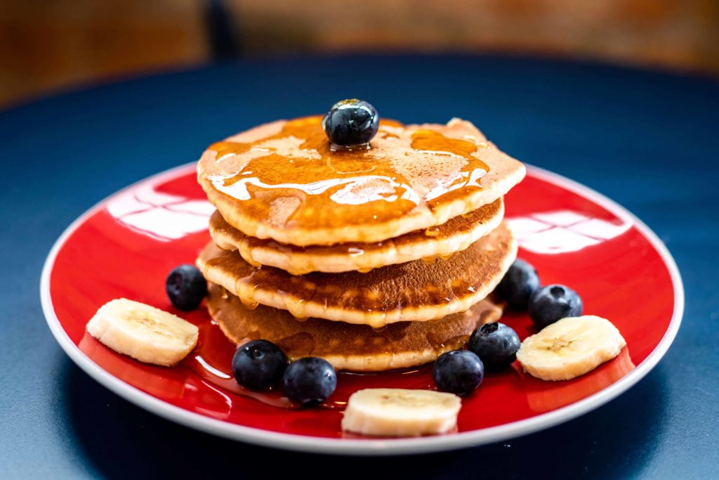 These tips for Food photography lighting setup can help you take mouth-watering images like these pancakes and blueberries