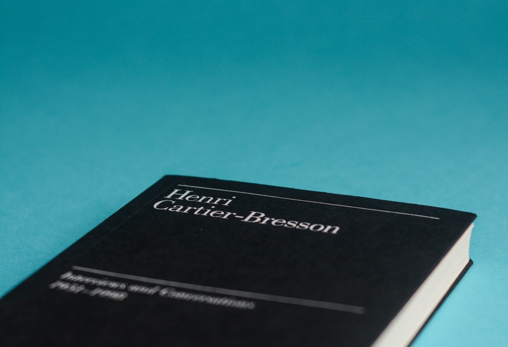 A close-up view of a book containing interviews with legendary French candid photographery, Henri Cartier-Bresson.