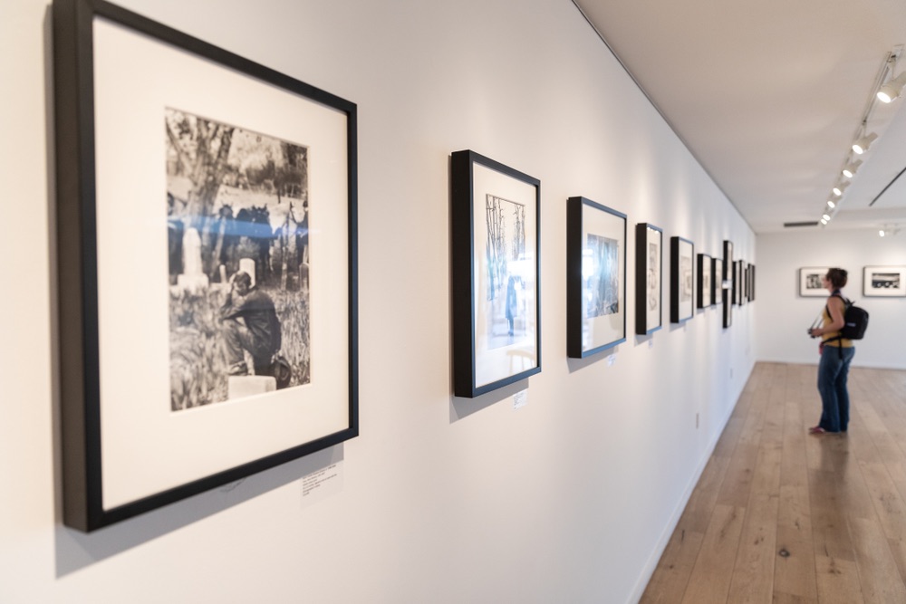 An exhibit of photographs by Henri Cartier-Bresson. Picture frames by famous French candid photographer in a museum.