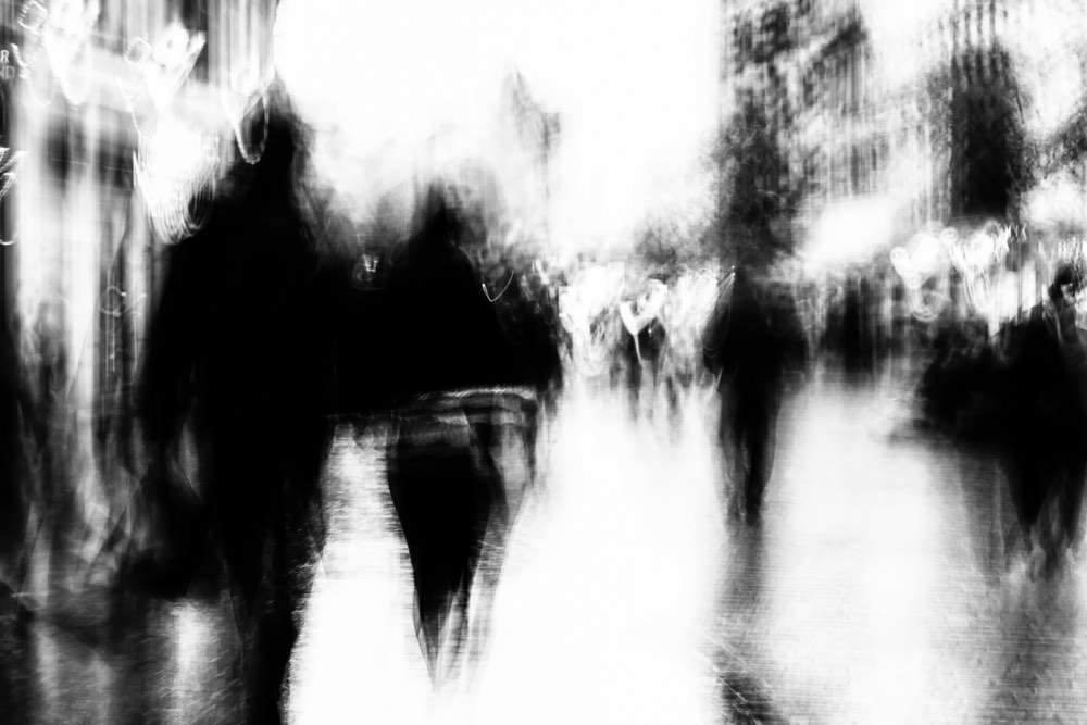 Intentional camera movement, or ICM photography. Monochrome exposure showing abstract, experimental results on the street.