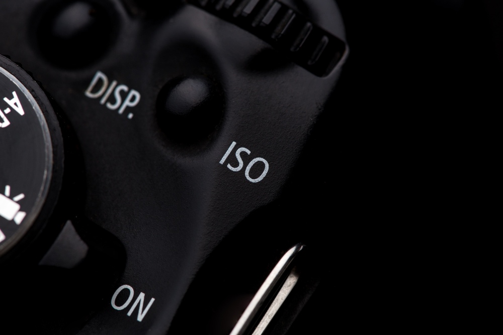 Close-up view of ISO button on a contemporary digital camera.