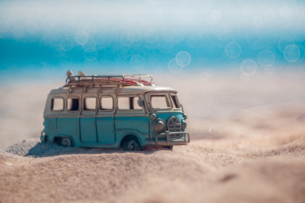 blurred background image of mini van.