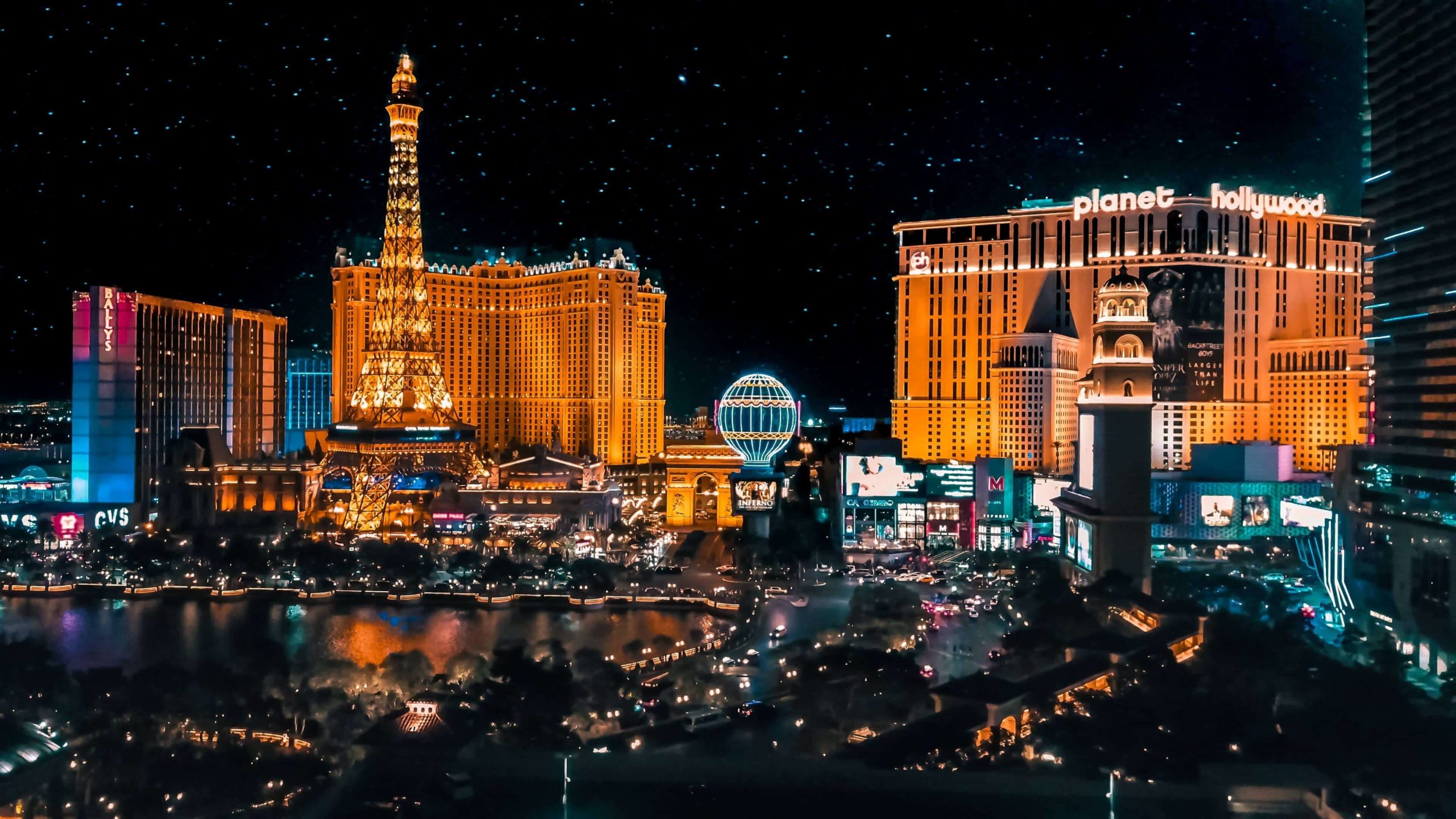 Neon lights, such as those on the Las Vegas strip seen here, are another light source.