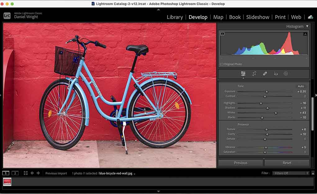 screenshot of editing in lightroom with bicycle red wall image.