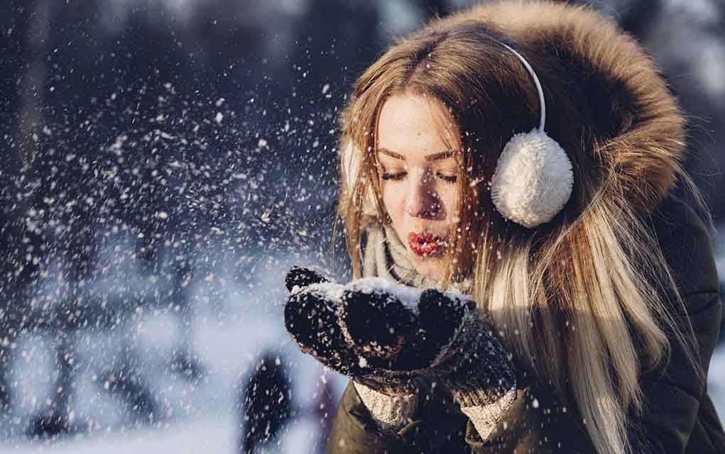 portrait of model with snowy background.