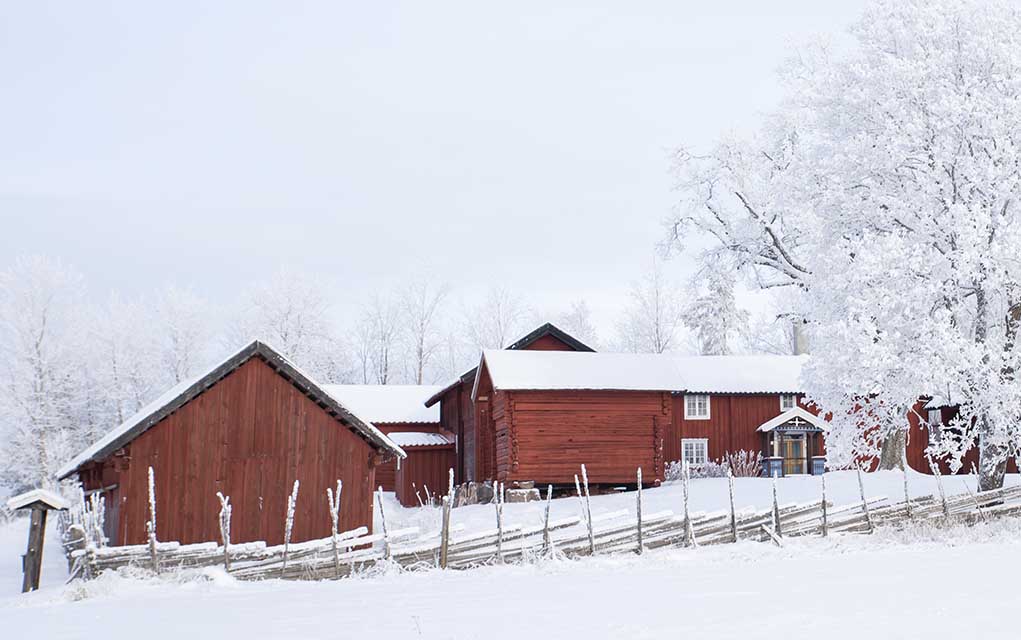 snow scene with red barn.