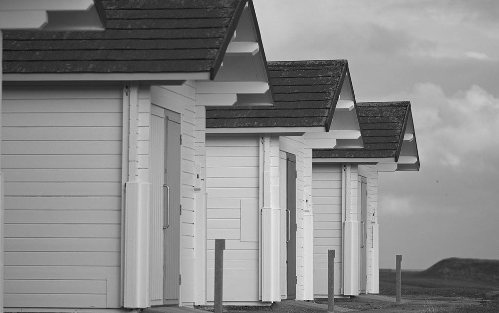 Stock photo of black-and-white huts.