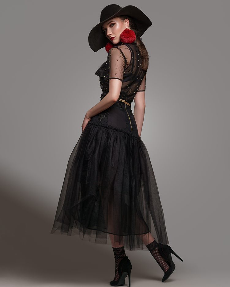 lighting a studio with fashion model wearing couture with hat.