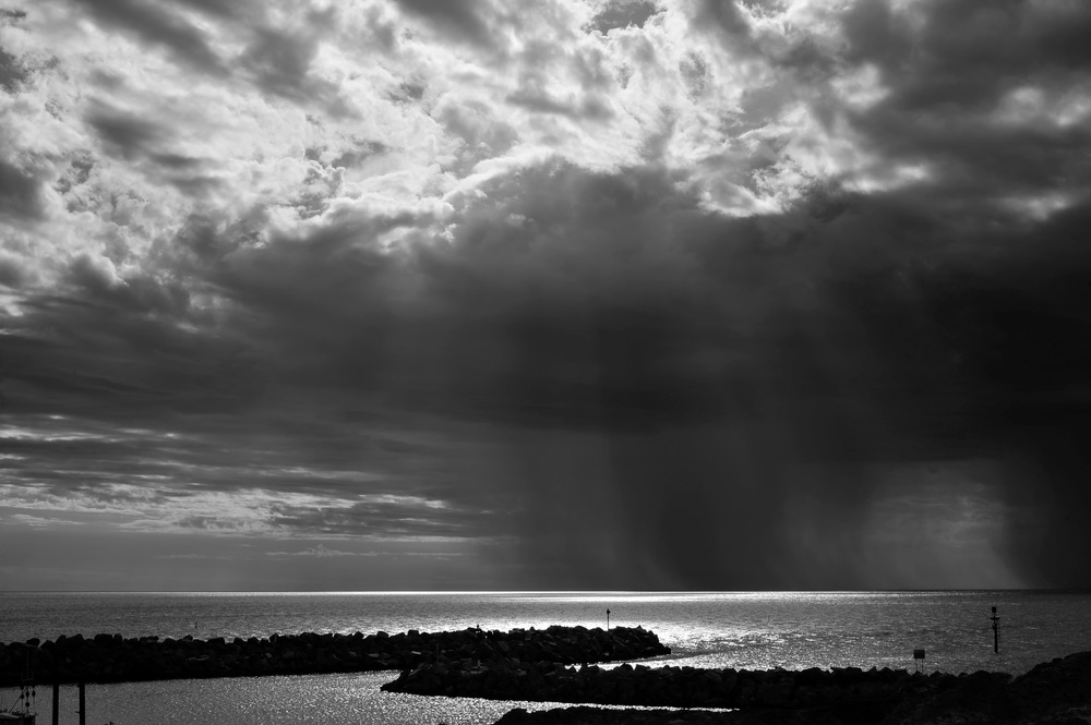 A dramatic landscape shot taken in black and white. Monochromatic landscape photography showcasing impressive tonal range thanks to the use of the Zone System.