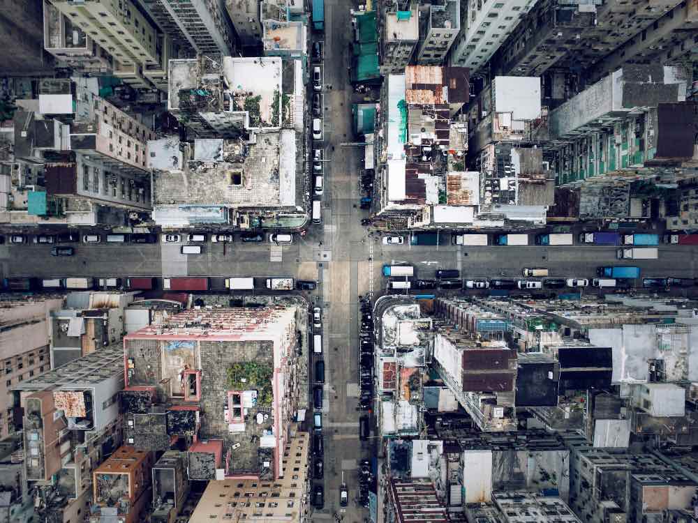 A bird's eye view of a crowded neighborhood in Hong Kong. Drone shot composed from a high altitude.