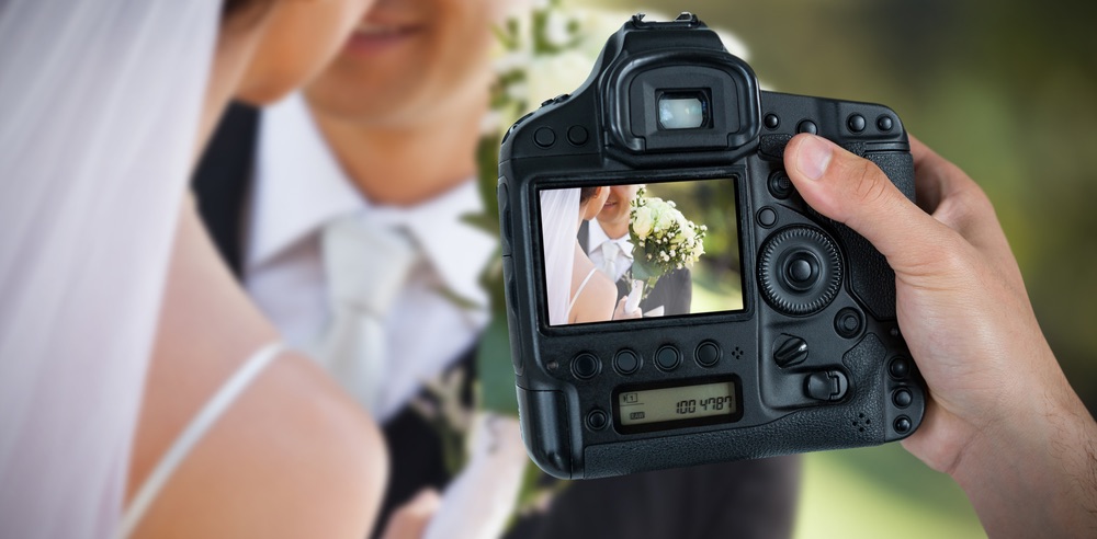 Composing a wedding portrait in live-view mode. Balancing speed with control in wedding photography.